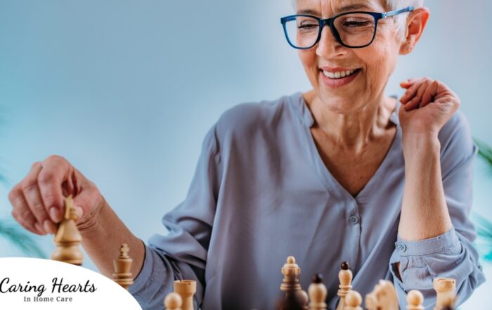 An older woman plays chess, an activity that can help older adults stay sharp.