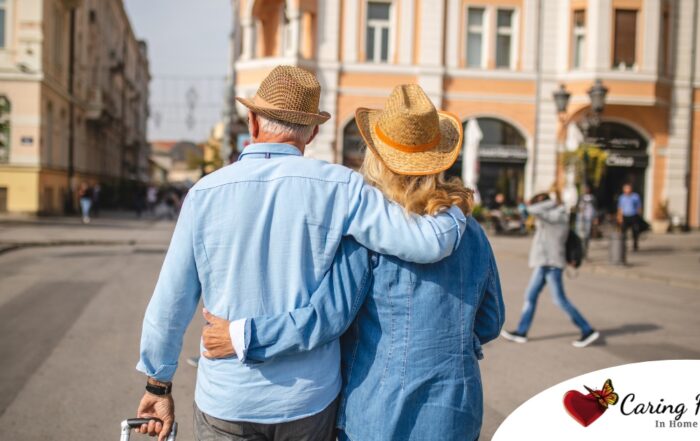 2 older adults hug while on vacation representing the successful outing that can still happen while caring for elderly loved ones.